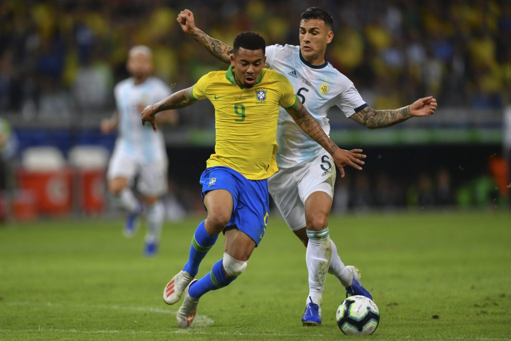 Brazil's Gabriel Jesus (L) is marked by Argentina's Leandro Paredes during their Copa America football tournament semi-final match at the Mineirao Stadium in Belo Horizonte, Brazil, on July 2, 2019. (Photo by Pedro UGARTE / AFP)